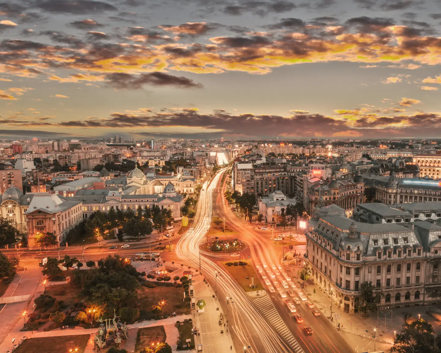 the university intersection in the city center of Bucharest, the capital of Romania, at dusk