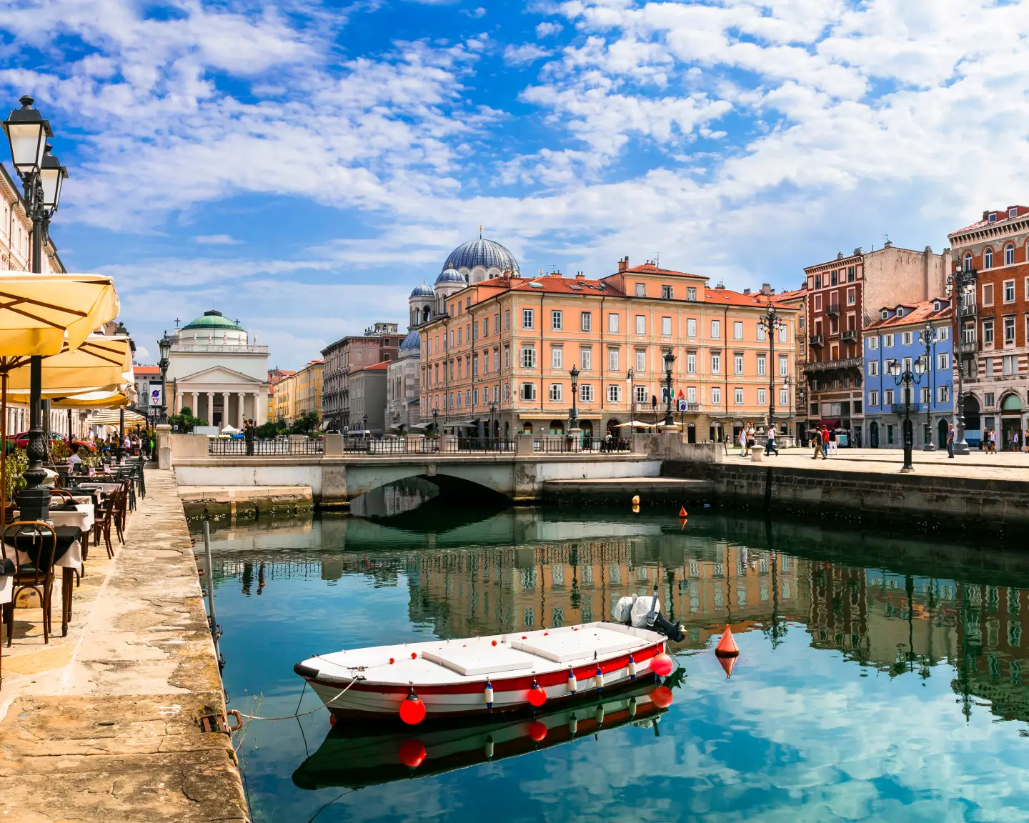 Canal view with boats in Trieste, Italy.