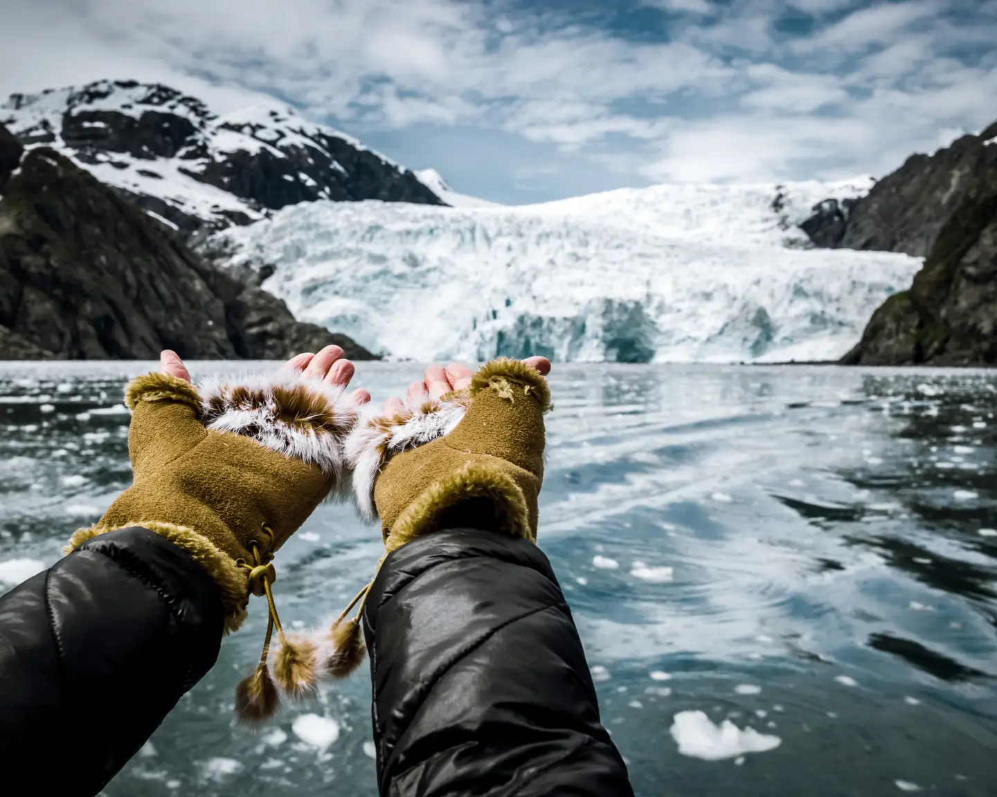 Woman blowing a goodbye kiss to the Holgate Glacier, Alaska.